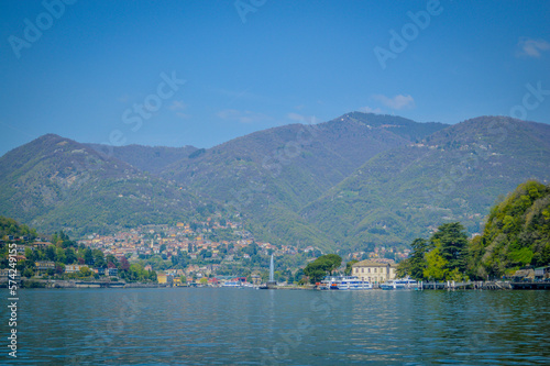Spring in Italy, Lombardy, Milano, Como lake and city. Landscape view on hills, park, old town and water, with some interesting details, close up and panoramic. © shooreeq