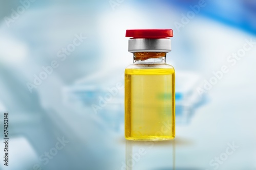 Medication vaccine in medical bottle on desk photo