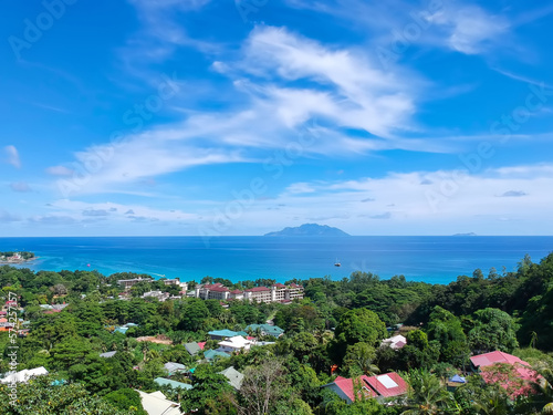 Panoramic view point of the Beau Vallon district and the beach with silhouette island  © Nils