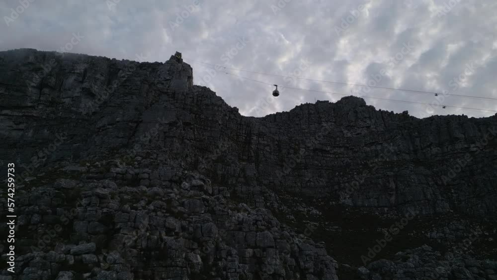 Drone shot of Cable Car Going Up Table Mountain in Cape Town, South Africa. Track Back Drone shot of Cable Car Going Up Table Mountain in Cape Town, South Africa. Track Back