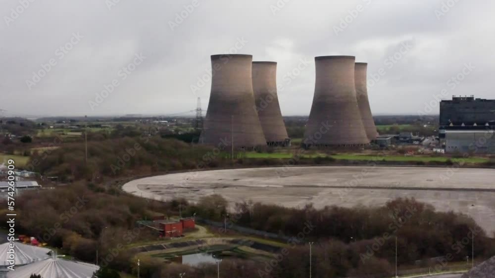 Aerial view slow pan across coal fired power station smokestack site, Fiddlers Ferry overcast skyline Aerial view slow pan across coal fired power station smokestack site, Fiddlers Ferry overcast skyline