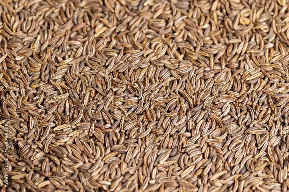 a large number of cumin seeds that are used as spices in cooking a large number of cumin seeds that are used as spices in cooking