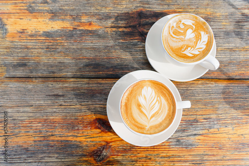 Coffee for Two: Top-View of Latte Art on Wooden Table
