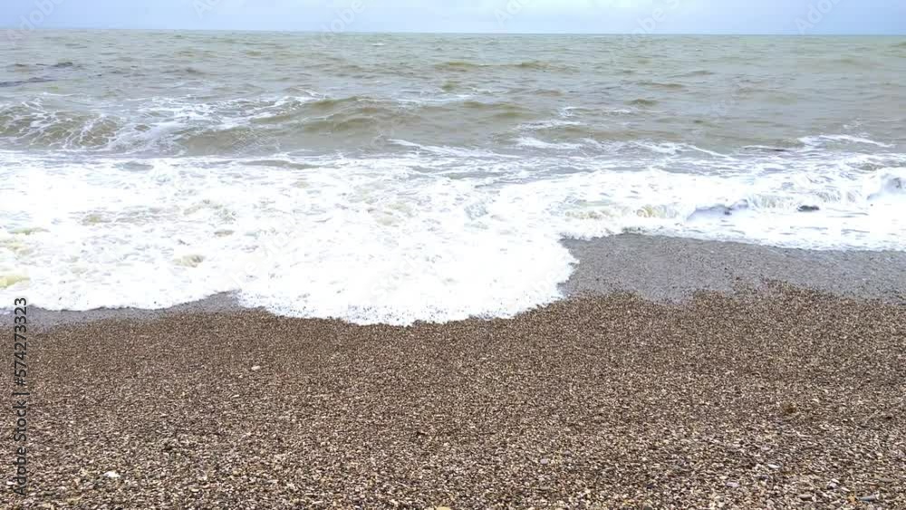 Powerful sea waves are crashing on the Black Sea coast. Waves splash on the beach with pebbles during a storm. Storm at sea. Panoramic view of the Black Sea. Russia. Sunset on the beach. 4K Powerful sea waves are crashing on the Black Sea coast. Waves splash on the beach with pebbles during a storm. Storm at sea. Panoramic view of the Black Sea. Russia. Sunset on the beach. 4K