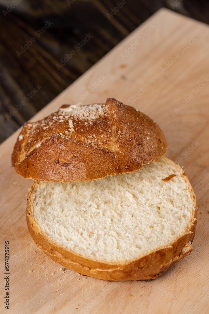 Wheat bun with large pieces of processed cheese inside Wheat bun with large pieces of processed cheese inside