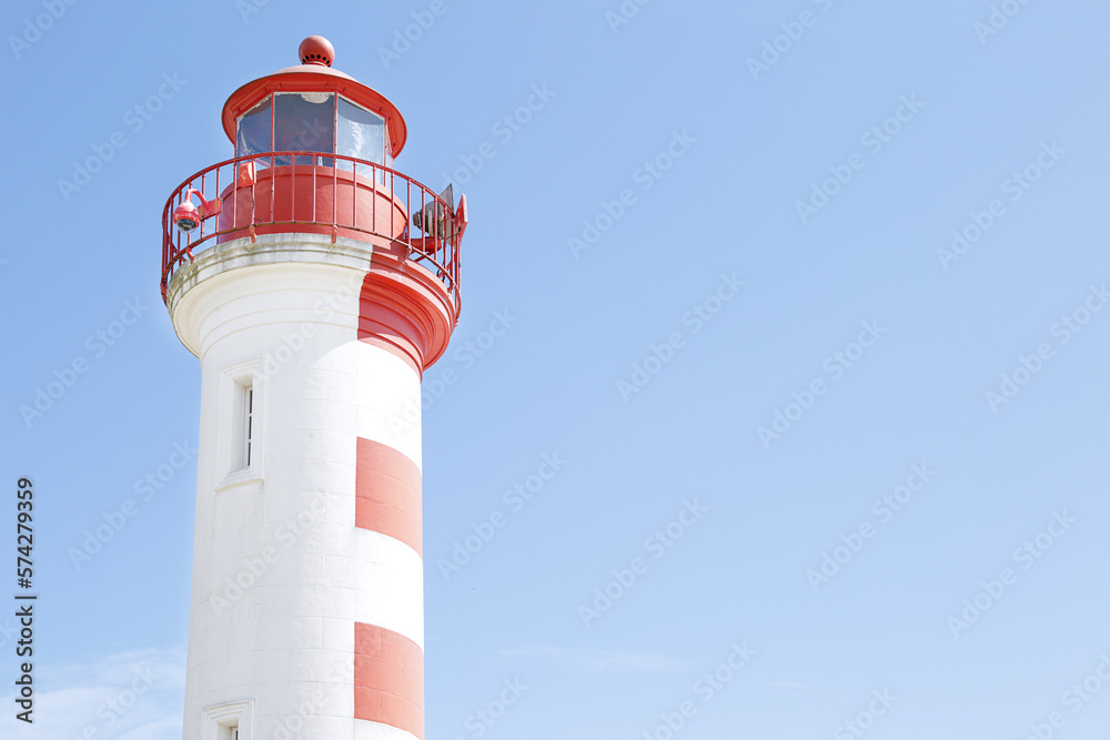 Red and white lighthouse in La Rochelle old harbor, France