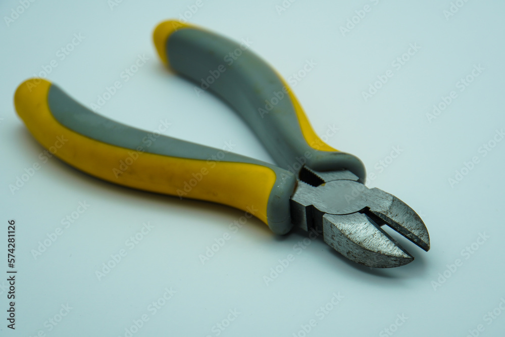 Obraz premium Rusty combination cutting pliers isolated on gray