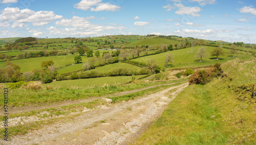 Panoramic landscape view of farms and hills above the town of Corwen in Denbighshire North Wales photo