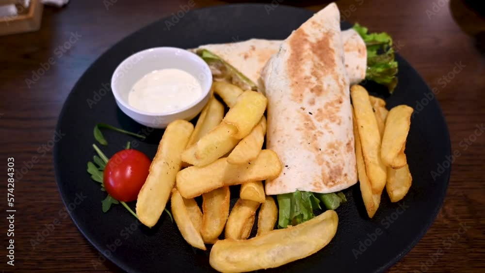 Tortilla with potatoes served in restaurant. Tortilla with chicken meat.