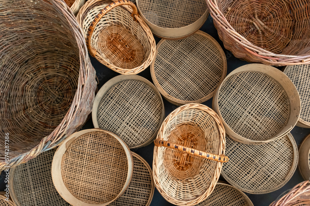 Set of various empty wicker baskets and sieves. Shop baskets of different kinds. Various retro kitchenware Set of various empty wicker baskets and sieves. Shop baskets of different kinds. Various retro kitchenware