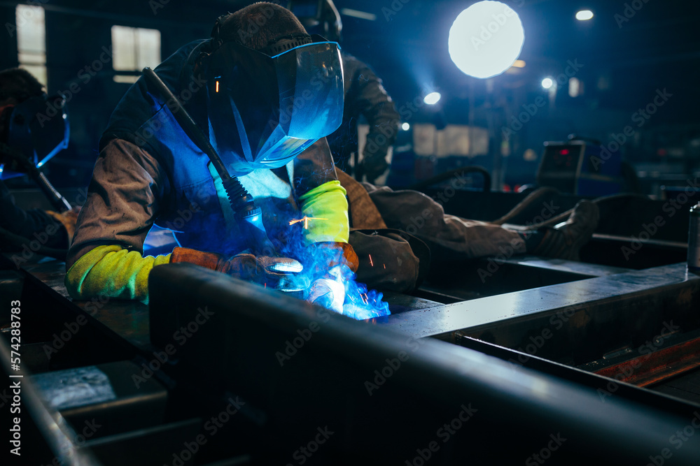 Industry worker welding iron at work Industry worker welding iron at work