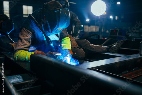 Industry worker welding iron at work