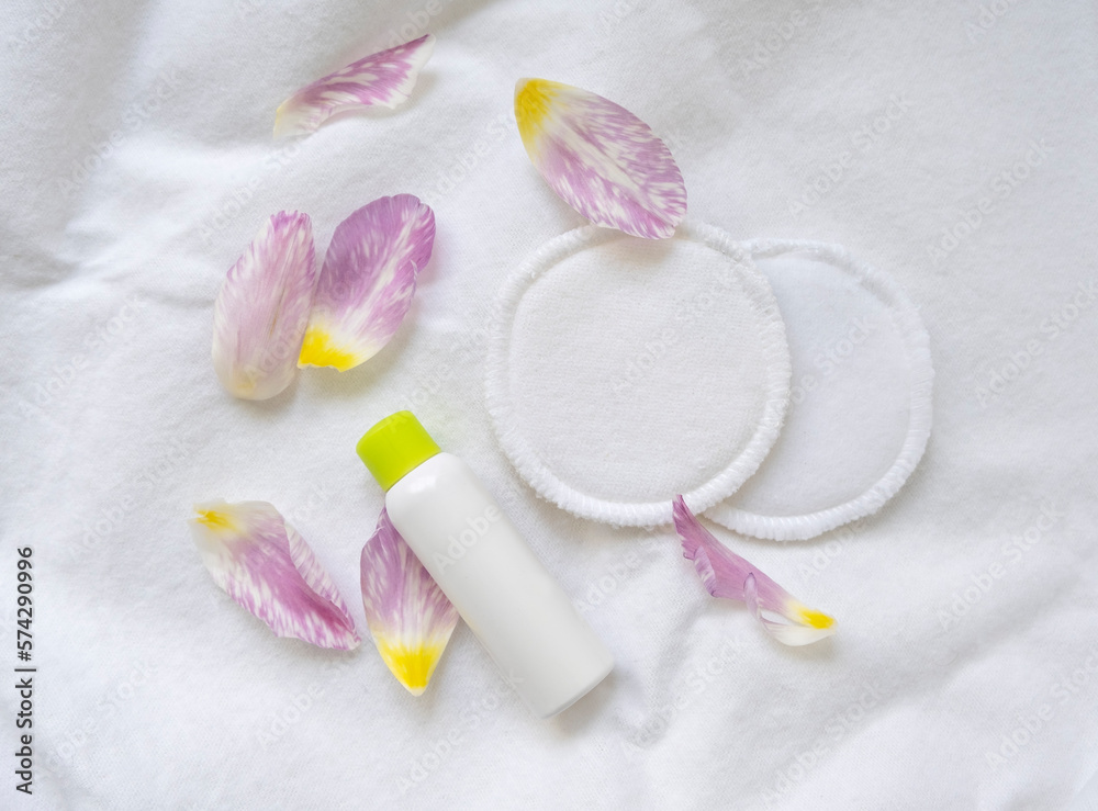 set of cosmetic products with flowers on white background set of cosmetic products with flowers on white background