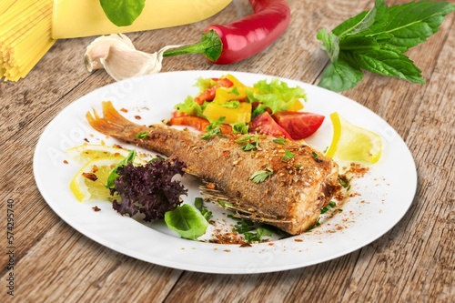 Tasty fresh Dish with fish fillet and salad