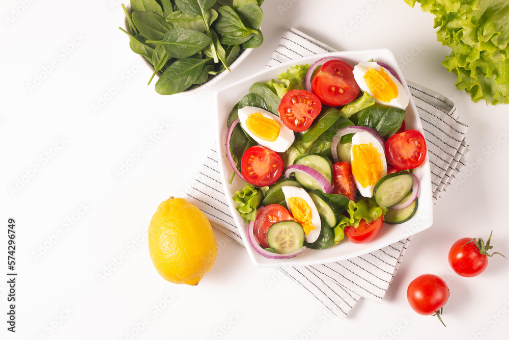 Appetizer healthy salad of fresh tomatoes, cucumber, spinach, lettuce and red onion. Vegan salad. Diet menu. Appetizer healthy salad of fresh tomatoes, cucumber, spinach, lettuce and red onion. Vegan salad. Diet menu.