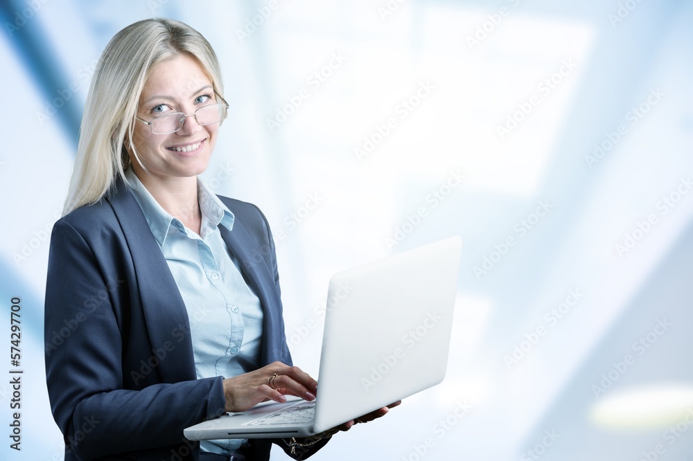Happy young smart business woman with laptop Happy young smart business woman with laptop
