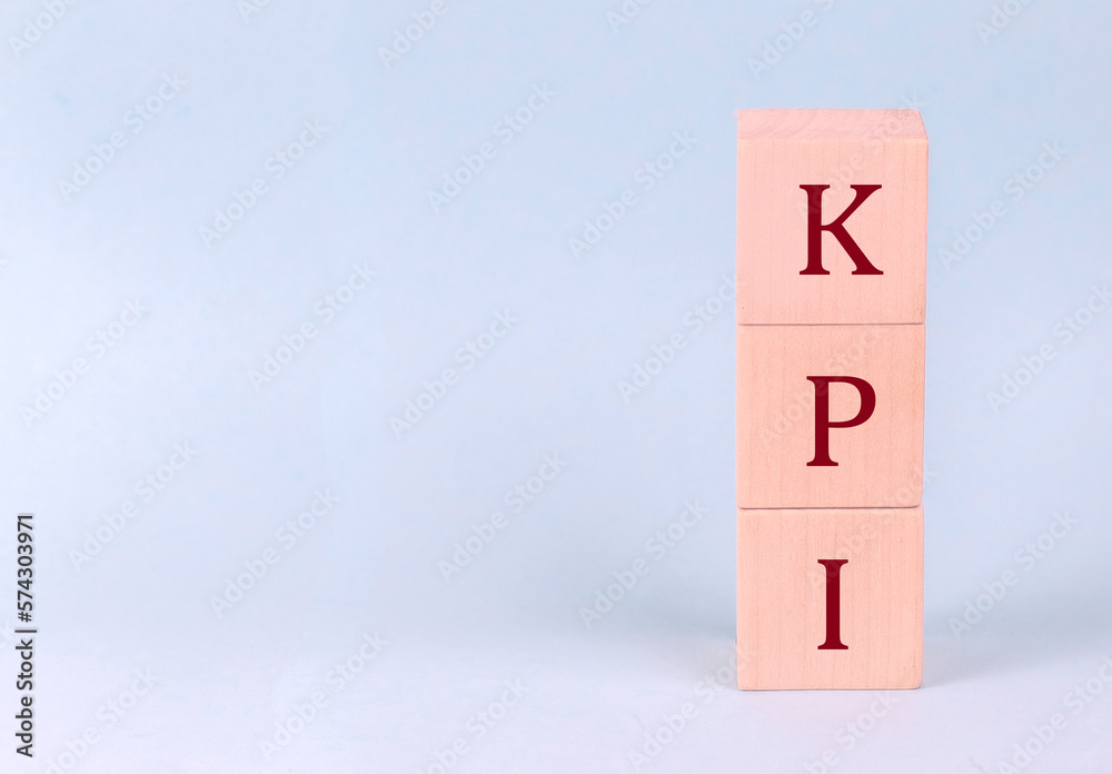 KPI on wooden cubes on a blue background