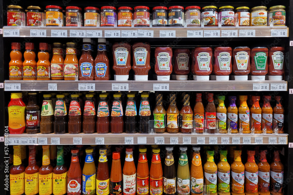 PENANG, MALAYSIA 22 FEB 2023 Various brands of salad dressing, chili