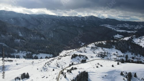 Aerial winter view of Rhodope Mountains around village of Stoykite and Pamporovo, Smolyan Region, Bulgaria photo