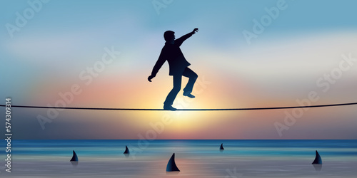 Concept de l’audace et de la prise de risque dans le monde des affaires, avec un funambule qui franchit un obstacle en équilibre sur une corde. photo