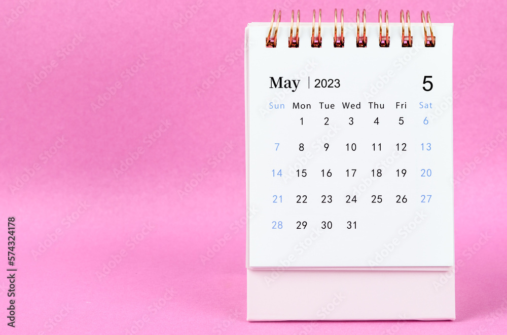 A May 2023 desk calendar on pink color background. - obrazy, fototapety, plakaty 