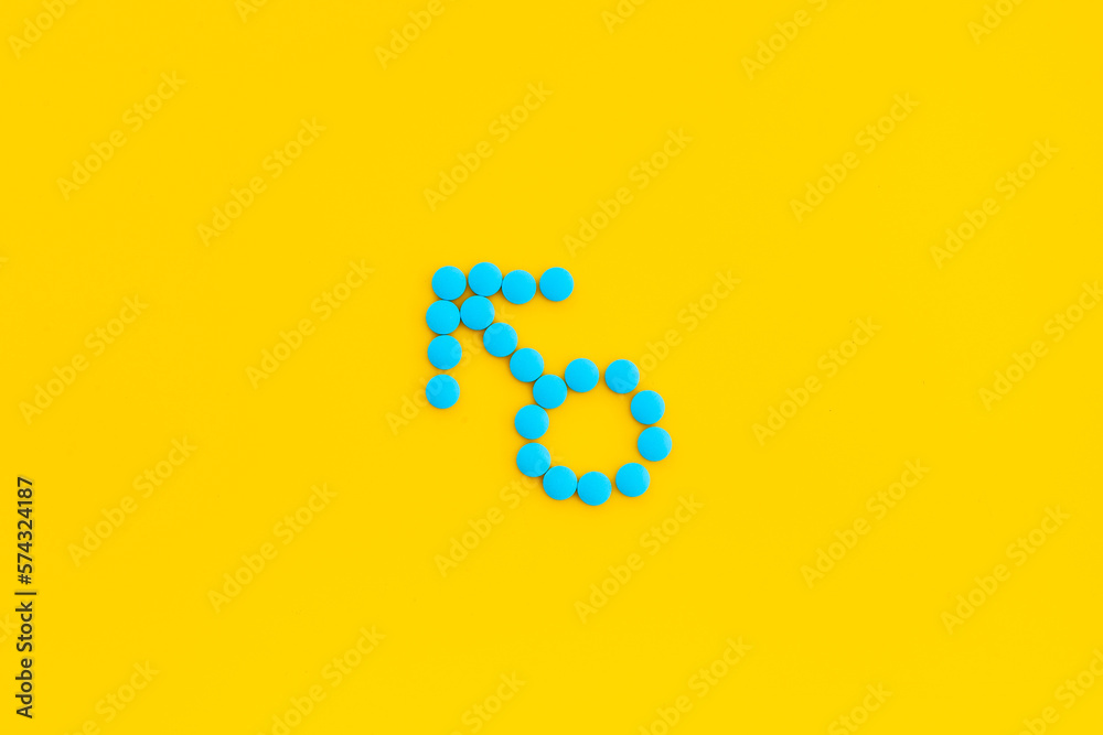 Male sign made of blue pills. Impotence concept. Mans health concept Male sign made of blue pills. Impotence concept. Mans health concept