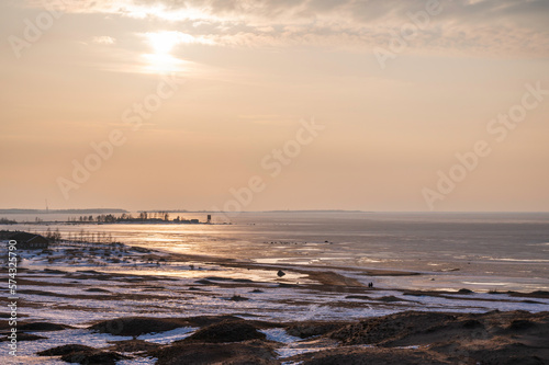 sunset over the beach and frozen sea in winter. Kalajoki, Finland © Sofie K