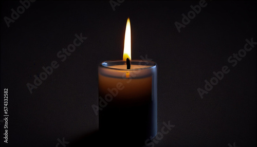 Lighted candle with black background.
Candle flame close up on a dark background. 