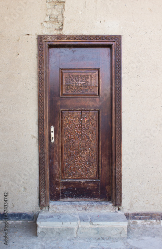 authentic arabian or ottoman style old wooden door decoration. arabic calligraphy ornament. © seyfullah