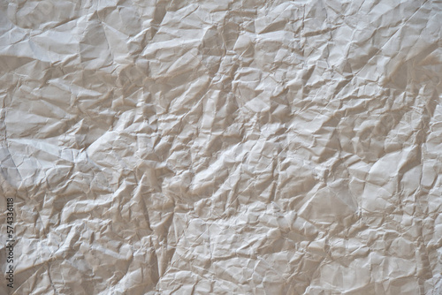 Crumpled white sheet of paper. White background.
