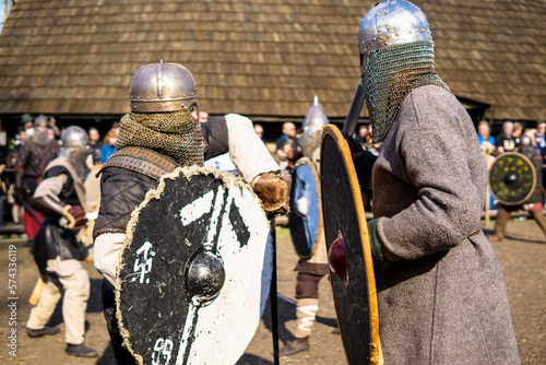 Unidentified participants at medieval fight during of international historical festival of VIKING culture. International historical festival of medieval culture. Fight at a historical festival. photo