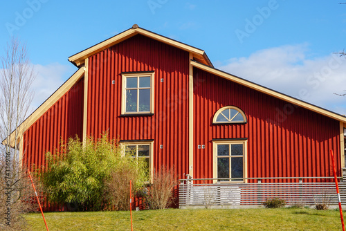 A typical Swedish red house in Småland, when the winter ends and spring slowly comes, Sweden