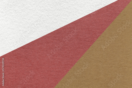 Texture of old craft white, red and brown color paper background, macro. Vintage abstract maroon cardboard
