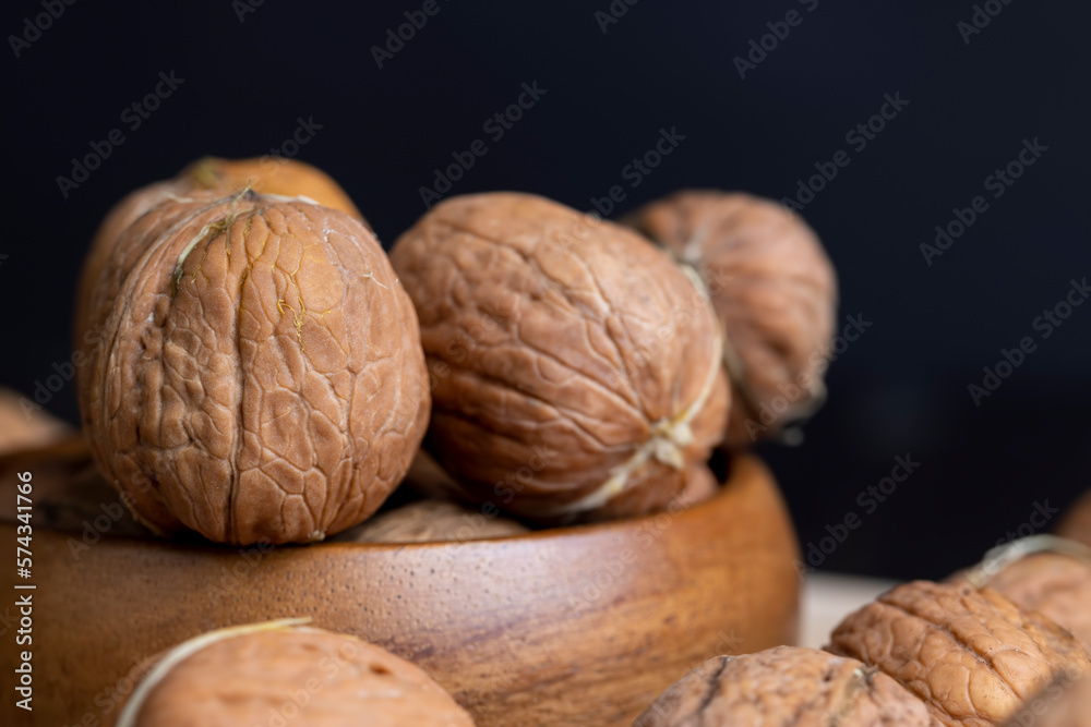 Unpeeled walnut harvest on the table Unpeeled walnut harvest on the table