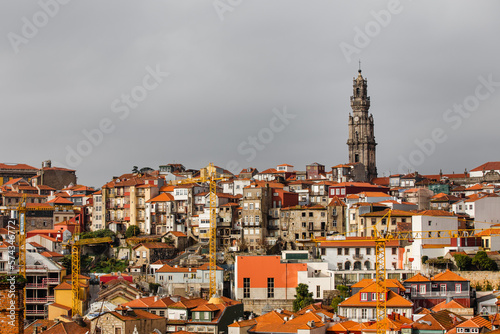 Bell tower at The Clérigos Church amidst orange rooftops in Porto © Filipe Lopes