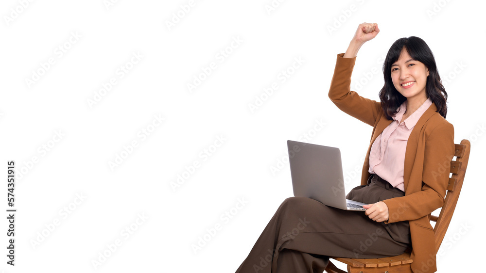Happy young business asian woman celebrating on her success. While her using laptop sitting on wooden chair isolate on white background Happy young business asian woman celebrating on her success. While her using laptop sitting on wooden chair isolate on white background