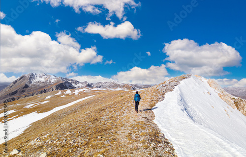 Ovindoli (Abruzzo, Italy) - The Monte della Magnola is a imponent and suggestive mountain peak in Abruzzo region, above the ski resorts of Ovindoli, here during the winter with snow and hiker. photo