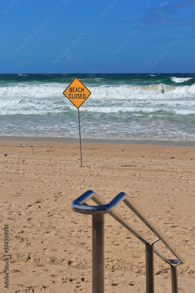 Manly Beach closed due to bad sea conditions-yellow signpost and white lifguard board. Sydney-Australia-504 Manly Beach closed due to bad sea conditions-yellow signpost and white lifguard board. Sydney-Australia-504