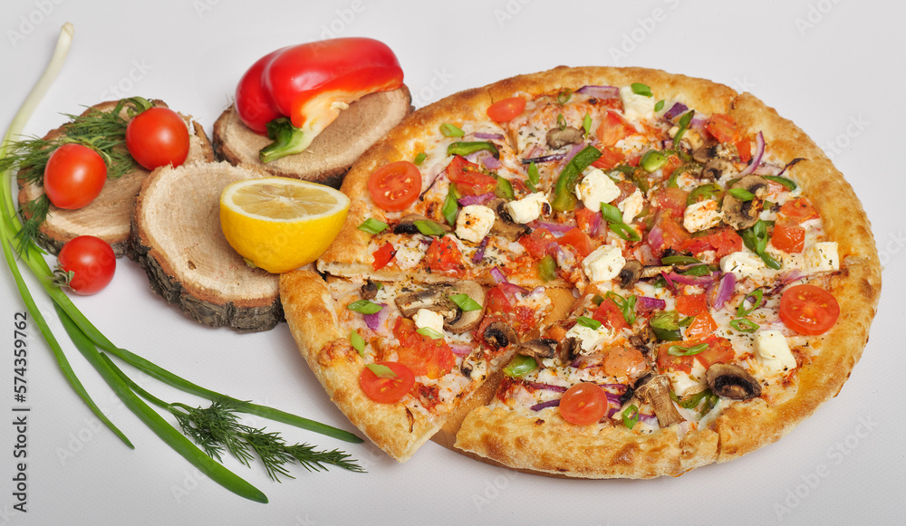 pizza with tomatoes and olives , with cheese, vegetables, mushrooms, round. Lemon, paprika, tomatoes, green onions, dill on original wooden stands. pizza with tomatoes and olives , with cheese, vegetables, mushrooms, round. Lemon, paprika, tomatoes, green onions, dill on original wooden stands.