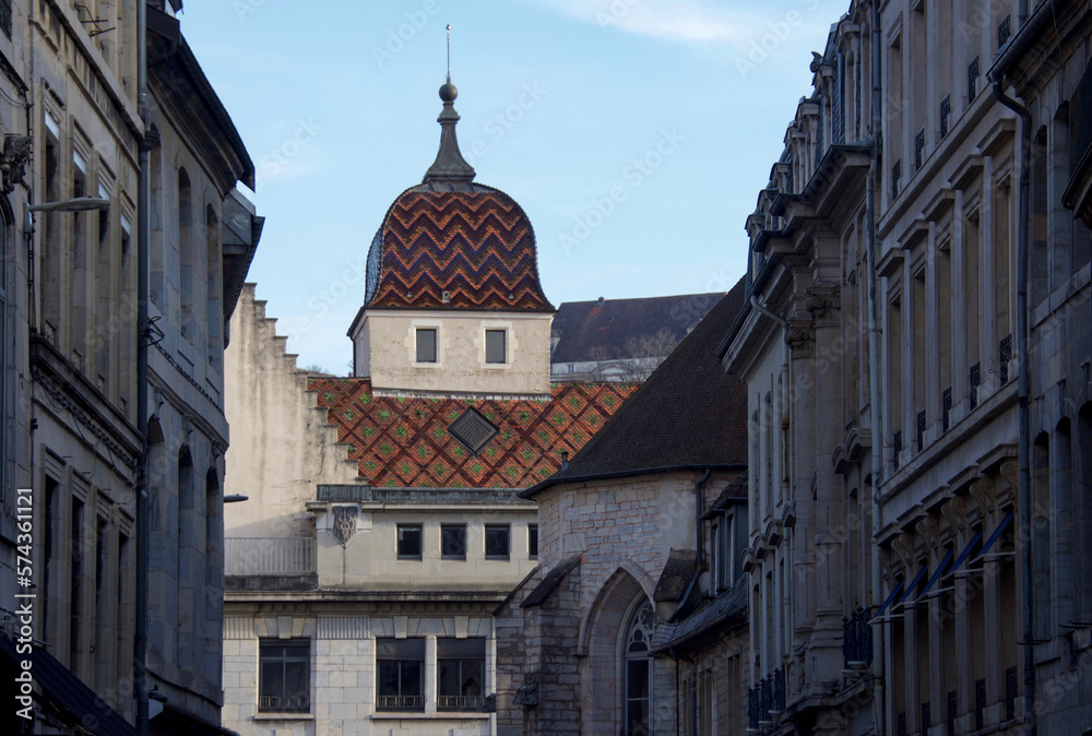 bell tower of the city of besançon and typical roof