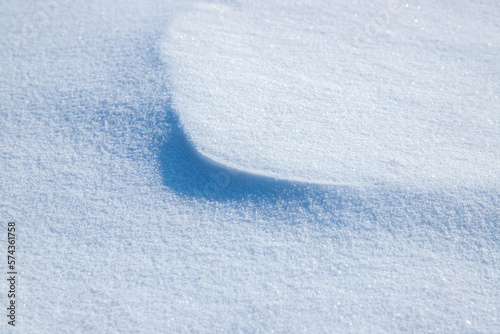 Fototapeta Naklejka Na Ścianę i Meble -  A close-up of a small snow bump