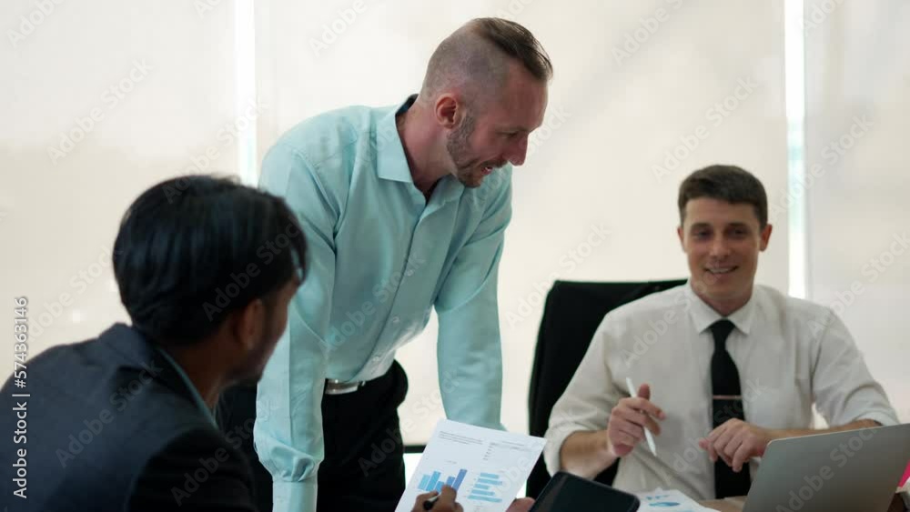 Group of young business people in a strategy workshop at the conference table. Group of young business people in a strategy workshop at the conference table.