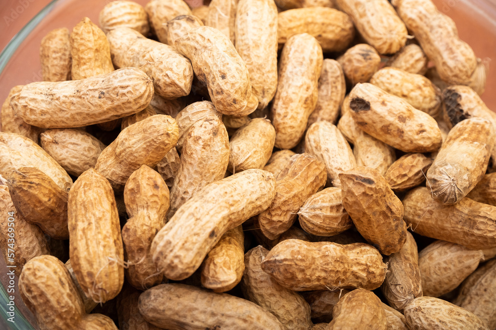 Peanuts in shell isolated on white background. Heap of peanuts close up Peanuts in shell isolated on white background. Heap of peanuts close up