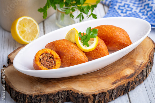 Kibbeh is a popular dish in Middle Eastern cuisine (Turkish name; icli kofte) photo