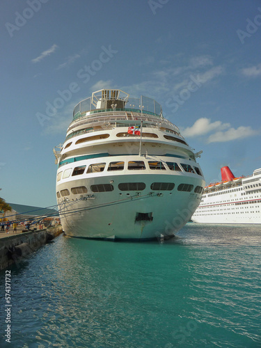 Modern cruiseship cruise ship liners line up in port of Nassau, Bahamas during mass transportation Caribbean cruising holiday vacation in summer © Tamme