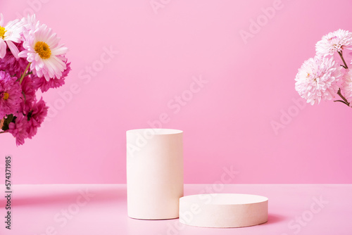 Podium or pedestal with chrysanthemum flowers. Mockup for your cosmetic products