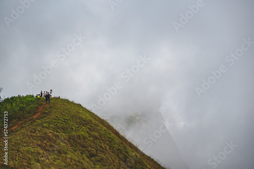 Chiangmai.thailand 19.11.2022 unacquainted people hiking on monjong mountain with mist cover the mountain.Doi Mon Jong is one of the top ten peaks in Thailand.