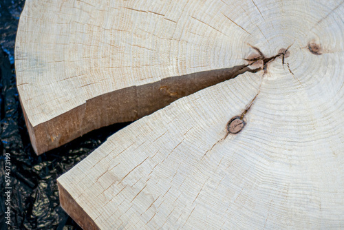 A crack in a round saw cut of a tree. A blank saw cut of wood for a countertop, for a table. Natural wooden table. Srub. Decorative wooden saw. view from above photo