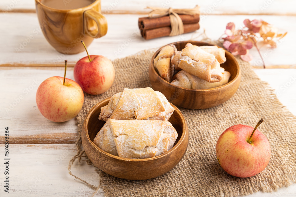 Homemade sweet cookie with apple jam and cup of coffee on white wooden. side view. Homemade sweet cookie with apple jam and cup of coffee on white wooden. side view.