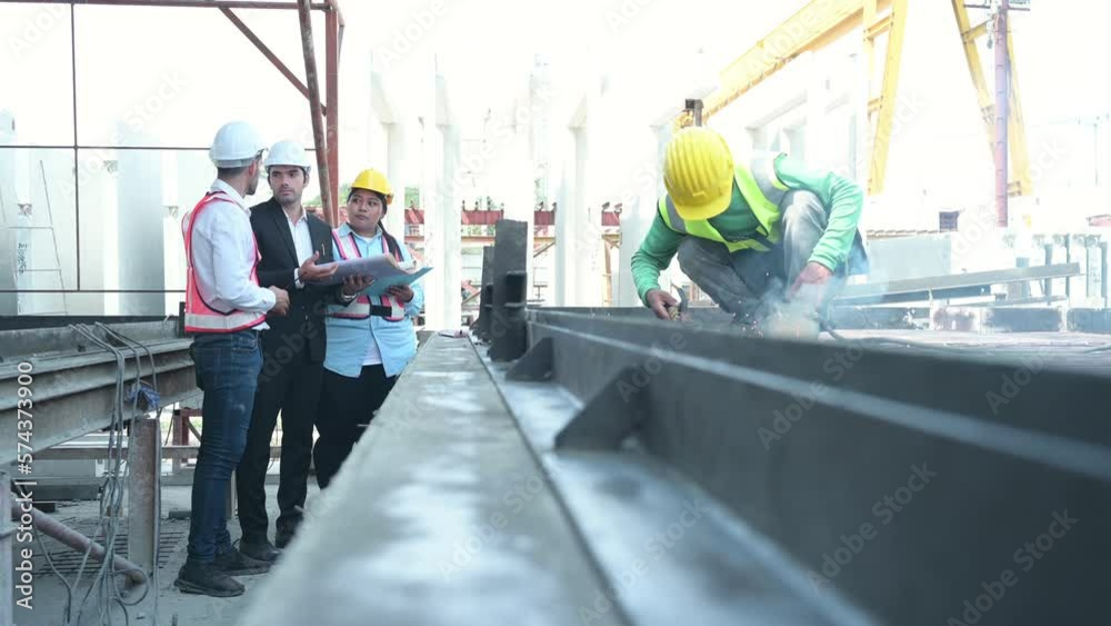 Group of architects, construction foremen, and construction engineers review the work and talk about how the project, in the construction site. Group of architects, construction foremen, and construction engineers review the work and talk about how the project, in the construction site.